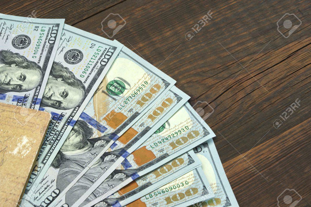 American One Hundred Dollar Bills In The Notepad Top View On - 