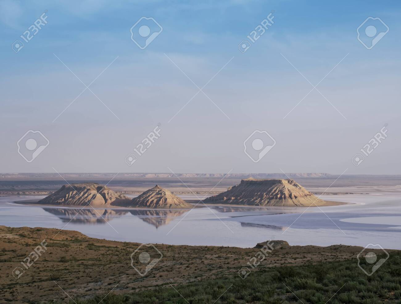 Mountains, rocks "Three brothers" in the salt marsh East. - 142655251 Mountains, rocks "Three brothers" in the salt marsh East. - 142655251