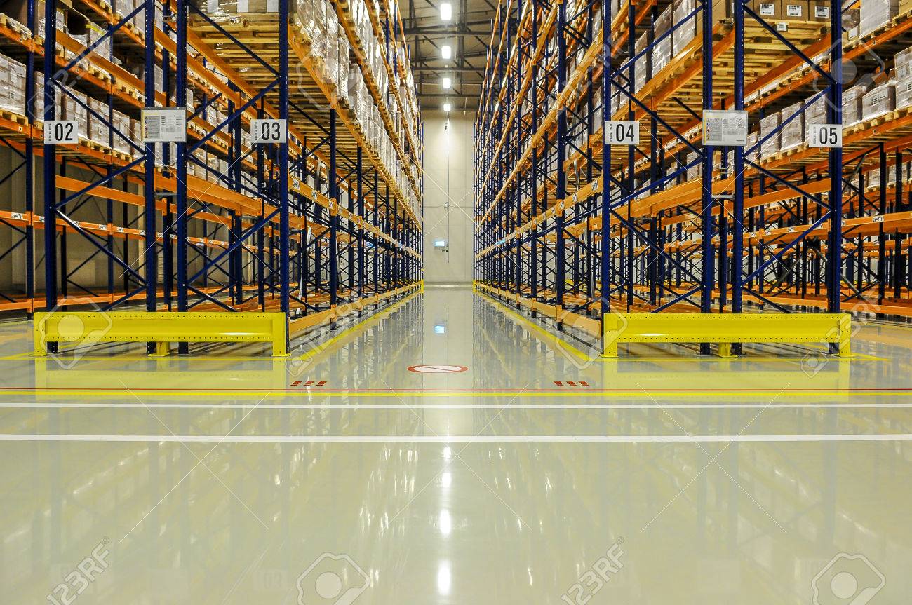 View through the racks of a large warehouse - 58702258 View through the racks of a large warehouse - 58702258
