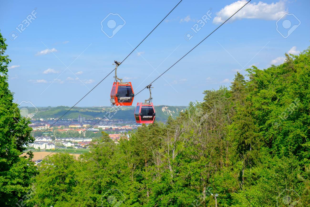 Maribor, Slovenia - May 2 2019: Red cabins of the Pohorska vzpenjaca cable car in Maribor, Slovenia connect the top of Pohorje mountain with the city - 137010533 Maribor, Slovenia - May 2 2019: Red cabins of the Pohorska vzpenjaca cable car in Maribor, Slovenia connect the top of Pohorje mountain with the city - 137010533