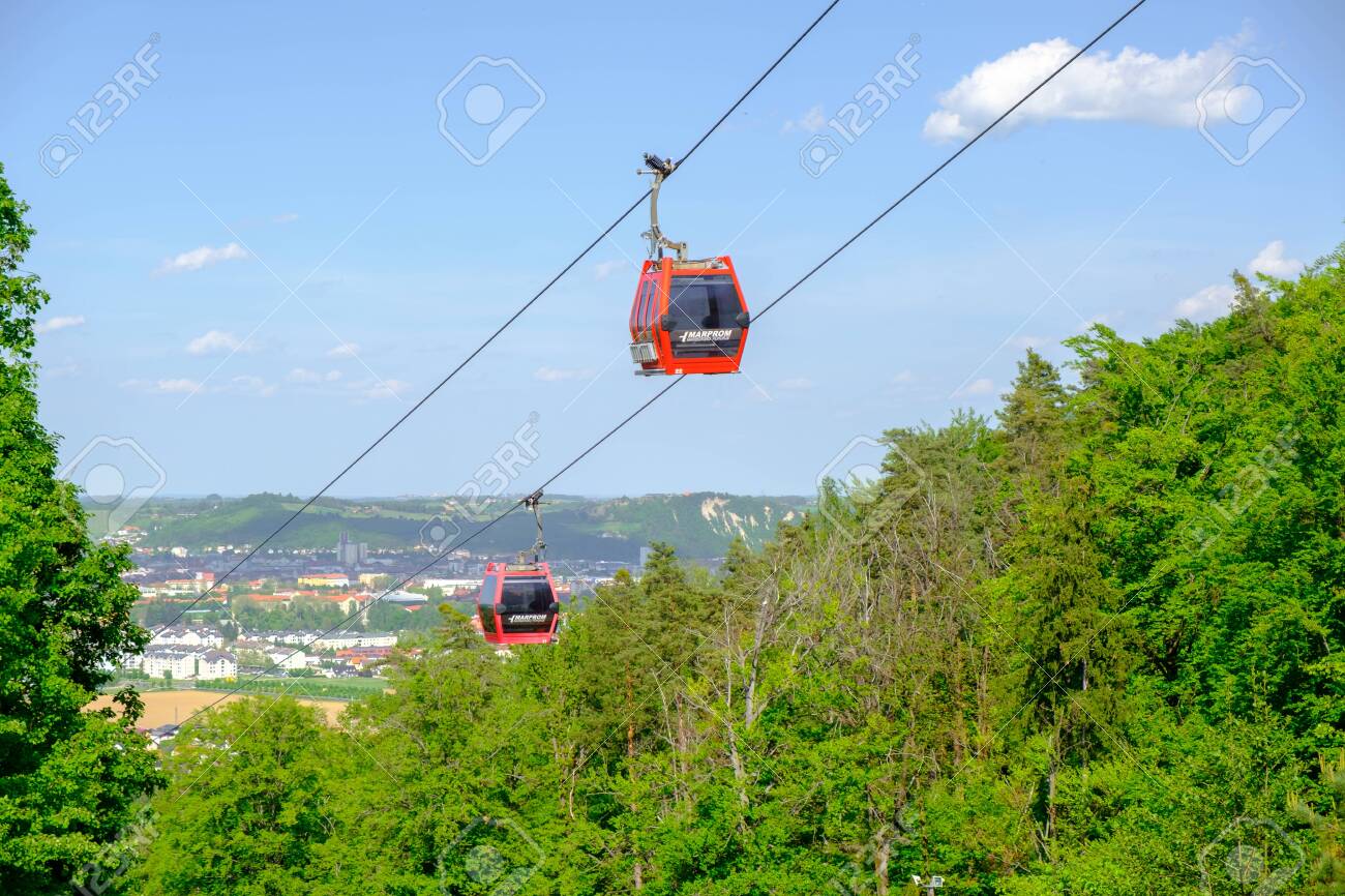 Maribor, Slovenia - May 2 2019: Red cabins of the Pohorska vzpenjaca cable car in Maribor, Slovenia connect the top of Pohorje mountain with the city - 137010534 Maribor, Slovenia - May 2 2019: Red cabins of the Pohorska vzpenjaca cable car in Maribor, Slovenia connect the top of Pohorje mountain with the city - 137010534