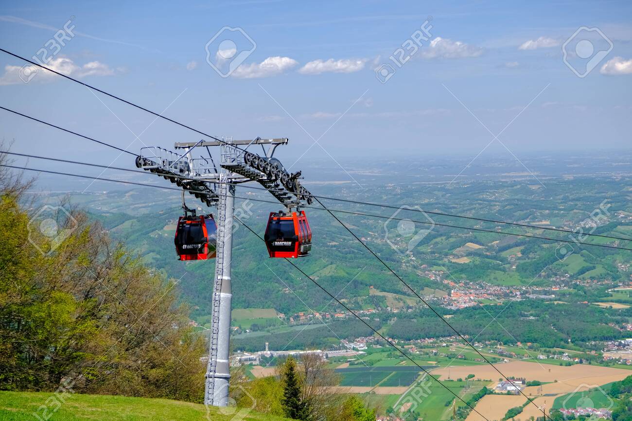 Maribor, Slovenia - May 2 2019: Red cabins of the Pohorska vzpenjaca cable car in Maribor, Slovenia connect the top of Pohorje mountain with the city - 137010543 Maribor, Slovenia - May 2 2019: Red cabins of the Pohorska vzpenjaca cable car in Maribor, Slovenia connect the top of Pohorje mountain with the city - 137010543