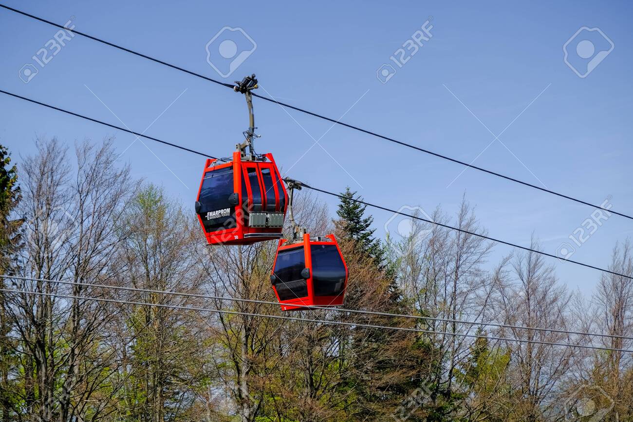 Maribor, Slovenia - May 2 2019: Red cabins of the Pohorska vzpenjaca cable car in Maribor, Slovenia connect the top of Pohorje mountain with the city - 137010546 Maribor, Slovenia - May 2 2019: Red cabins of the Pohorska vzpenjaca cable car in Maribor, Slovenia connect the top of Pohorje mountain with the city - 137010546