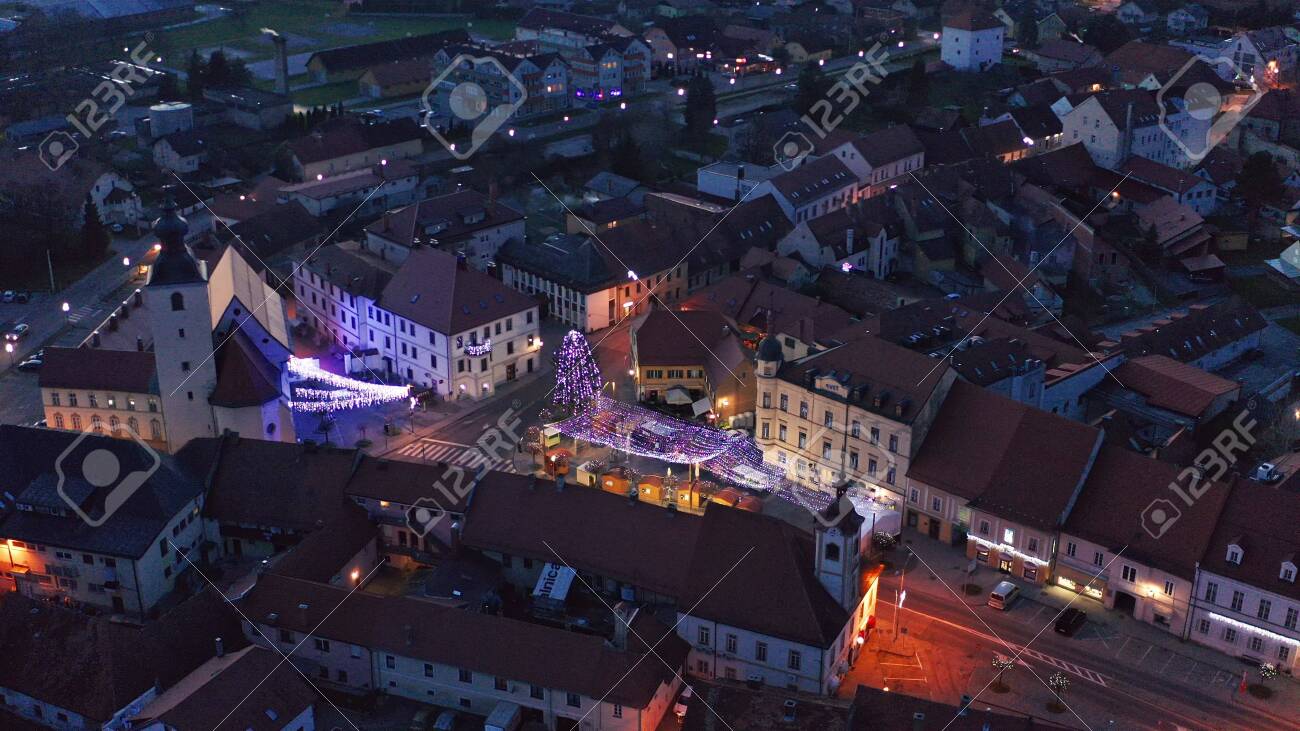 Slovenska Bistrica, Slovenia - Dec 25 2019: Aerial view of Christmas fair on main square in Slovenska Bistrica, a small medieval town in Slovenia with wooden shop stands, closed on Christmas eve - 137012199 Slovenska Bistrica, Slovenia - Dec 25 2019: Aerial view of Christmas fair on main square in Slovenska Bistrica, a small medieval town in Slovenia with wooden shop stands, closed on Christmas eve - 137012199