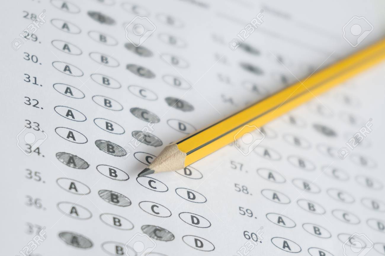 a pencil sitting on a test bubble sheet optical form of an free bubble sheet