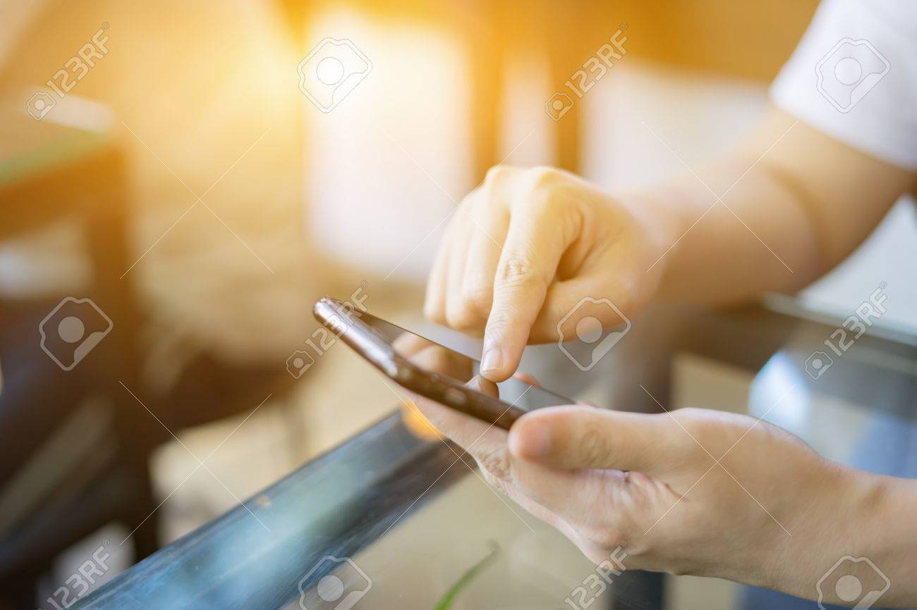 Online banking payment communication network technology internet wireless tools development mobile smartphone sync app: Business woman holding smart phone for online or shopping payment,vintage color - 72943028 Online banking payment communication network technology internet wireless tools development mobile smartphone sync app: Business woman holding smart phone for online or shopping payment,vintage color - 72943028