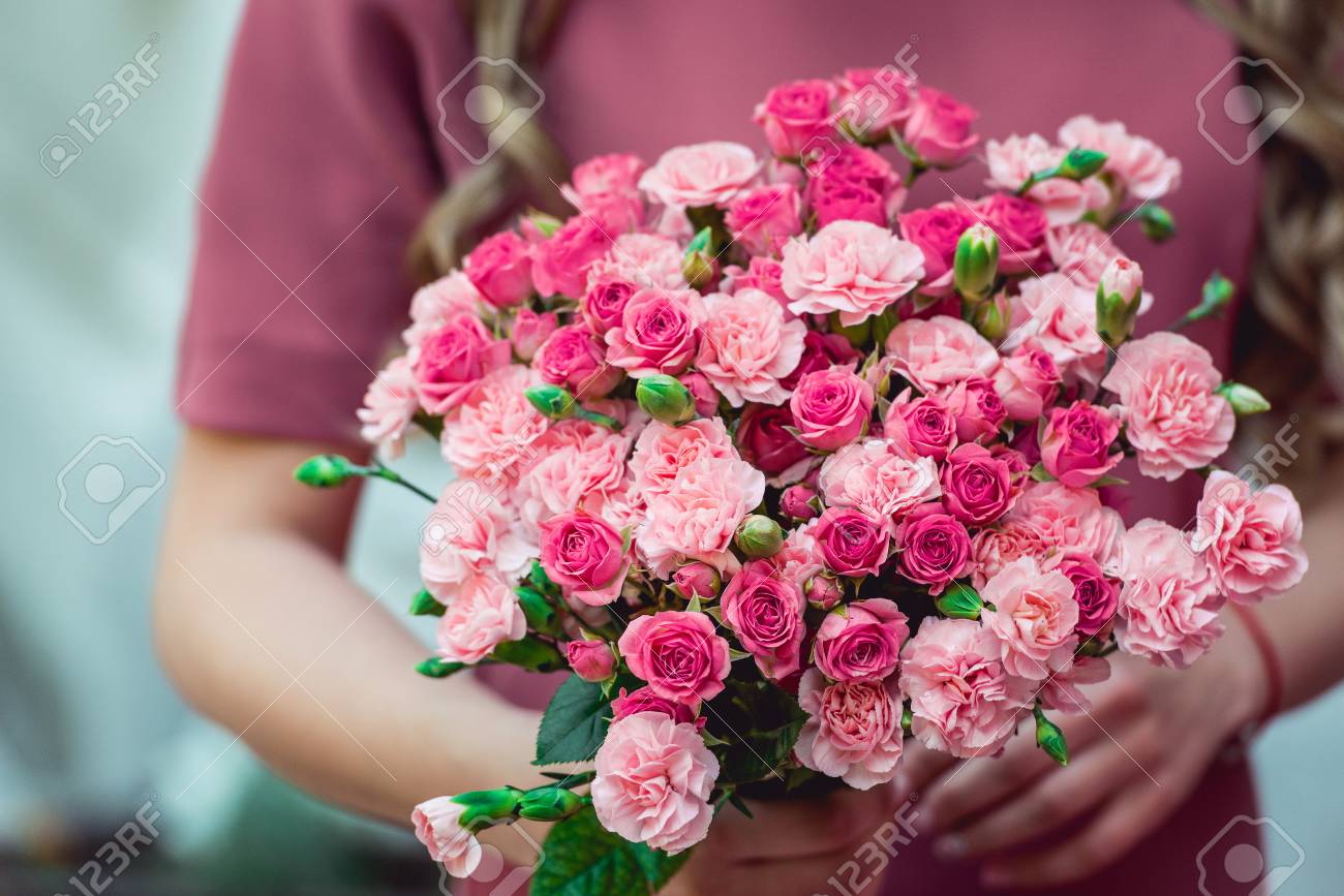 Woman In A Dress Holding Wedding Bouquets Of Biege Carnations An Stock Photo Picture And Royalty Free Image Image