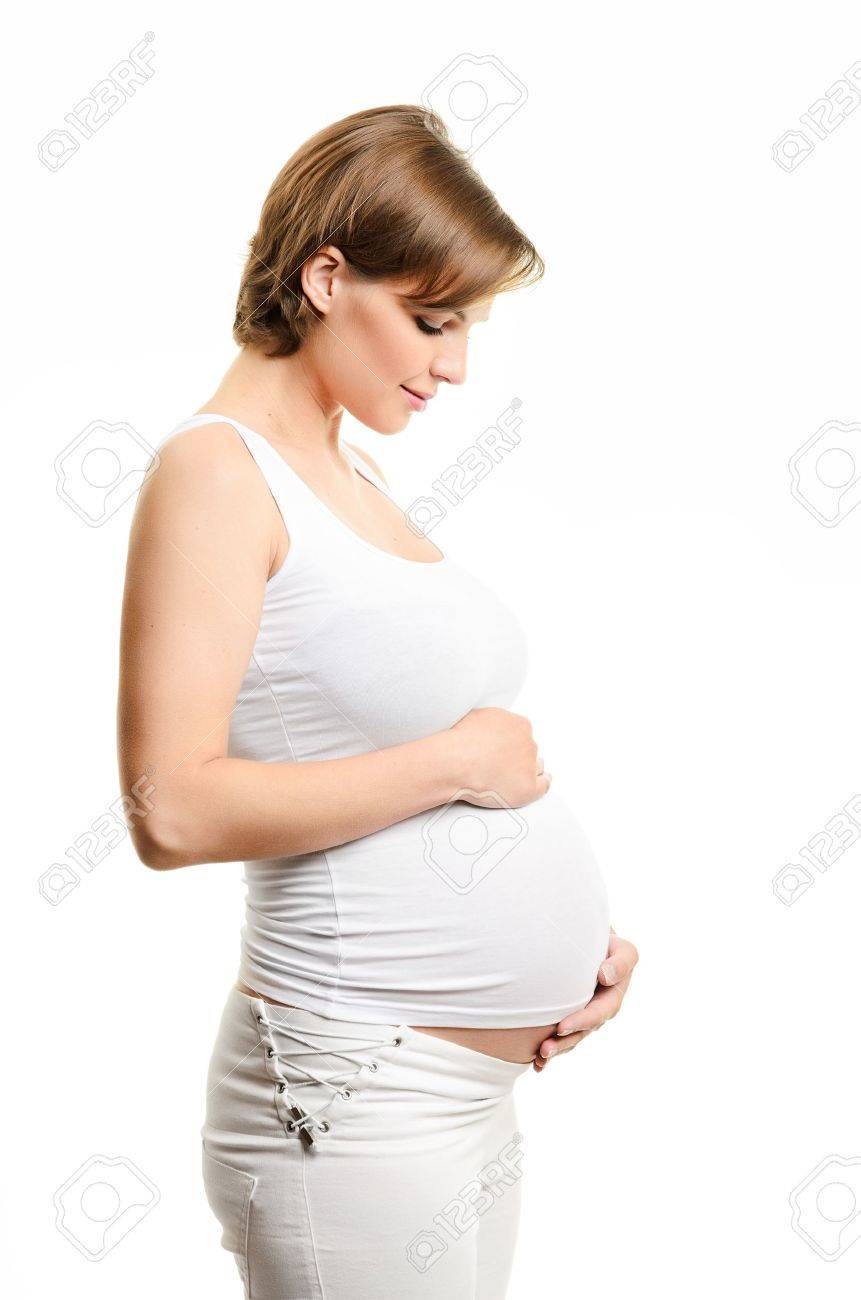 Pregnant woman caressing her belly over white background - 13619026 Pregnant woman caressing her belly over white background - 13619026