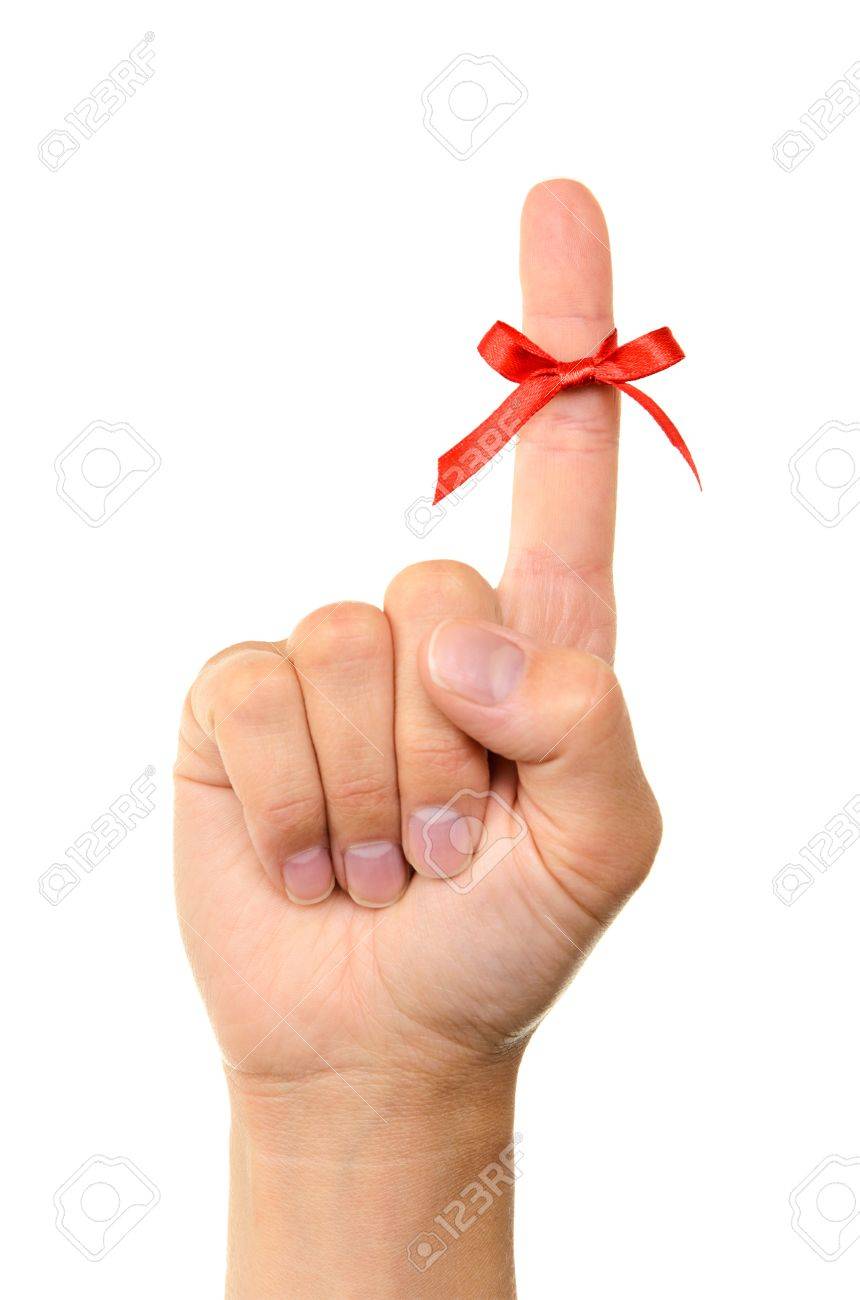 Red bow on finger, isolated on white background - 13944931 Red bow on finger, isolated on white background - 13944931