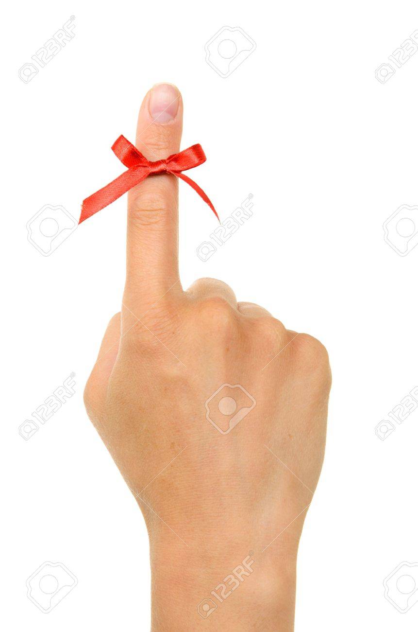 Red string tied around finger as a reminder, isolated on white background. - 13944933 Red string tied around finger as a reminder, isolated on white background. - 13944933
