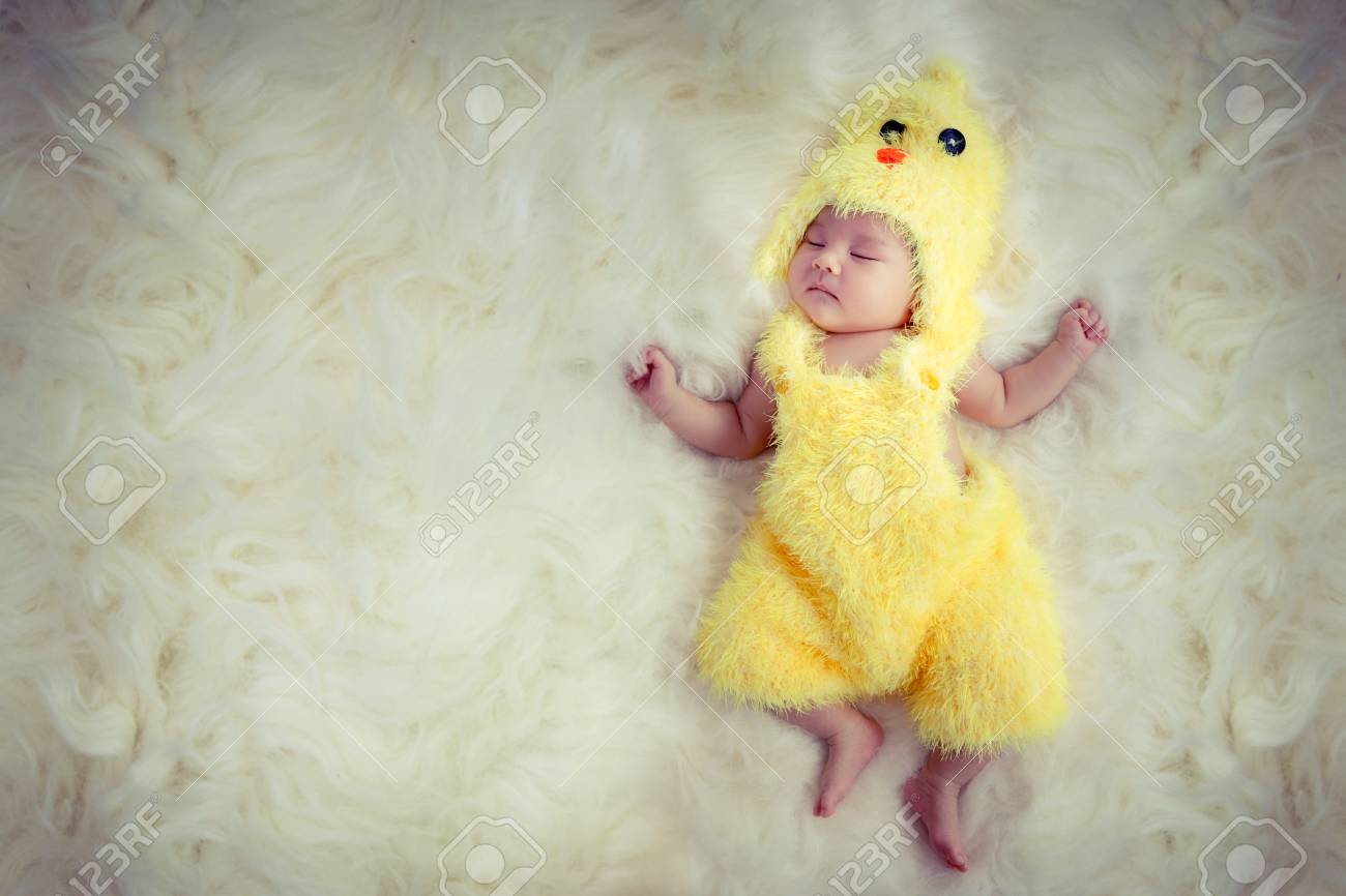 baby in yellow dress
