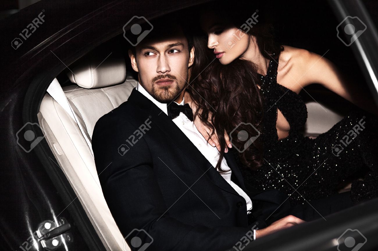 Sexy couple in the car. Hollywood stars. - 57773183 Sexy couple in the car. Hollywood stars. - 57773183