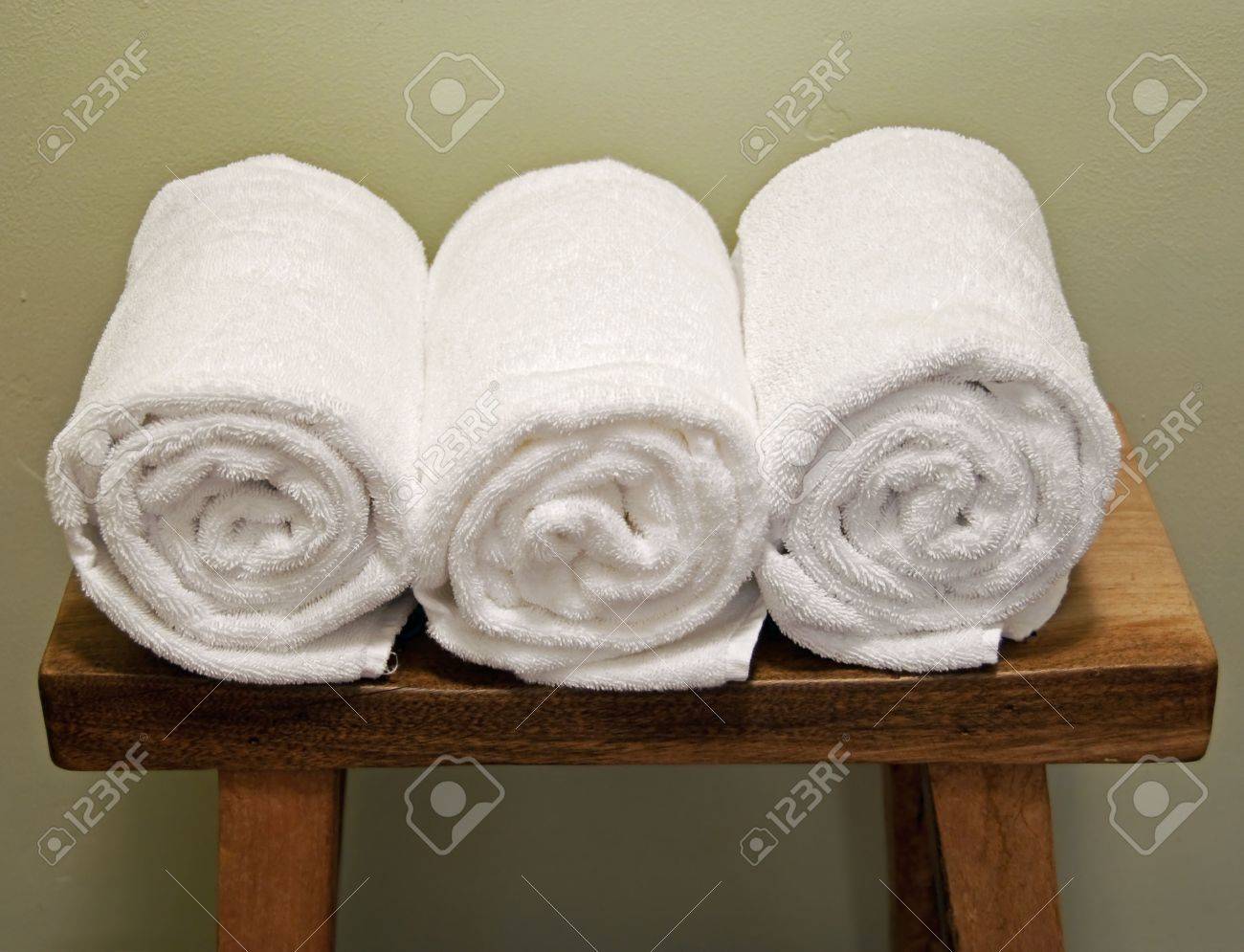 clean rolls of towels on a bench - 5744908 clean rolls of towels on a bench - 5744908