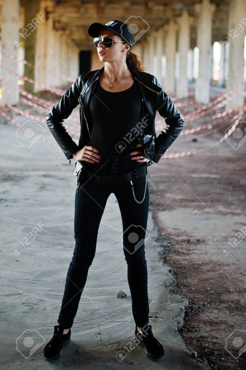 Sexy Female Agent At Abandoned Place. Stock Photo, Picture and Royalty Free  Image. Image 87715088.