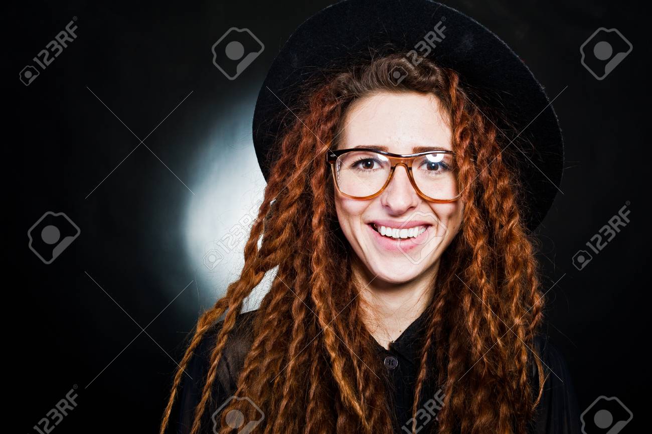 Studio Shoot Of Girl In Black With Dreads Hat And Glasses At