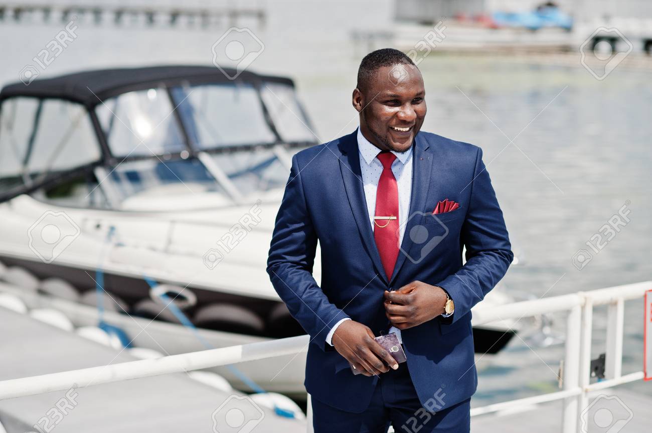 African American Happy Successful Man At Suit Against Yacht. Rich Black  Business Man. Stock Photo, Picture And Royalty Free Image. Image 104224324.