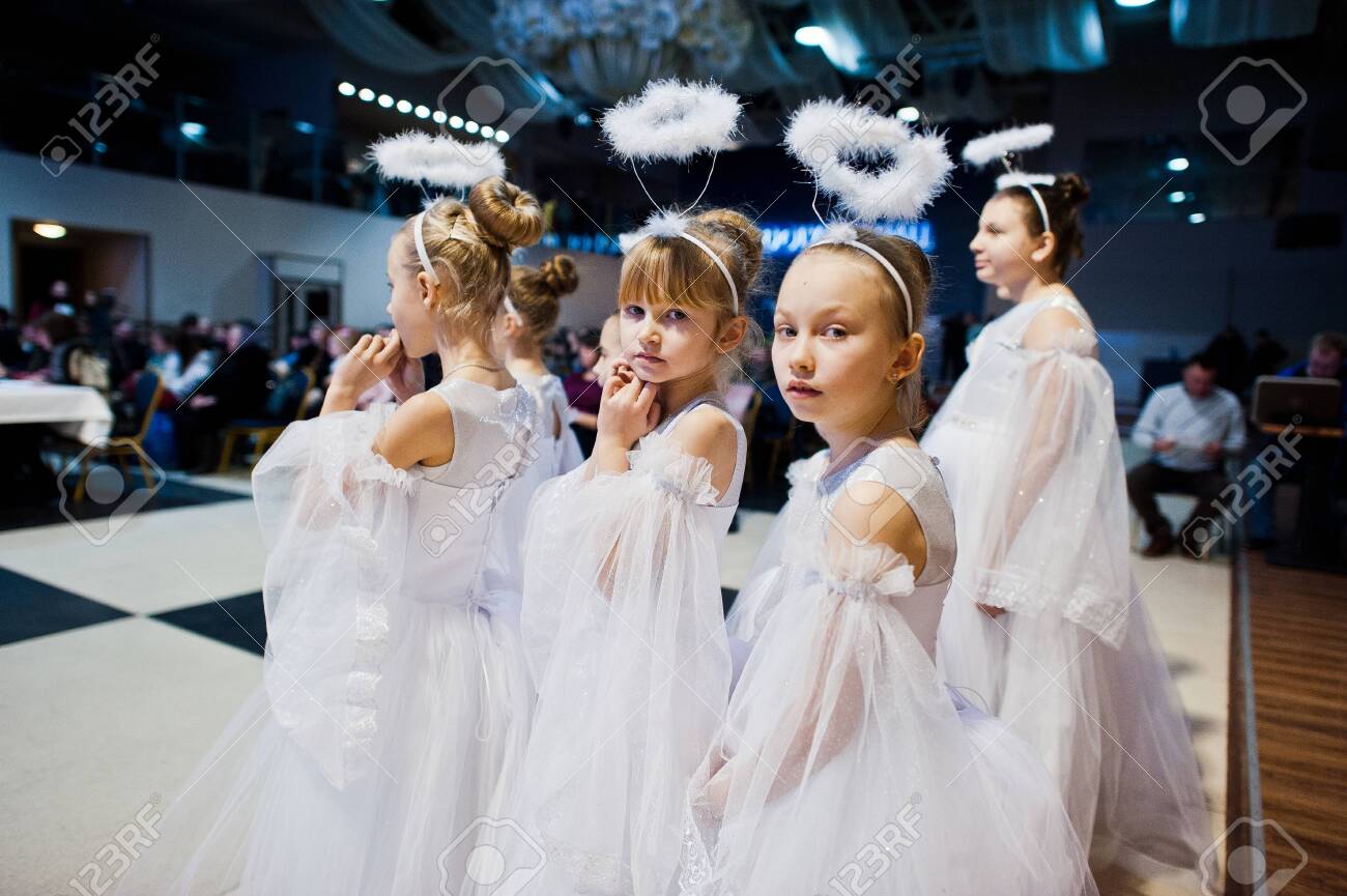 Kyiv, Ukraine - September 1, 2019: Childrens angels in white dresses at Christmas event. - 138123491 Kyiv, Ukraine - September 1, 2019: Childrens angels in white dresses at Christmas event. - 138123491