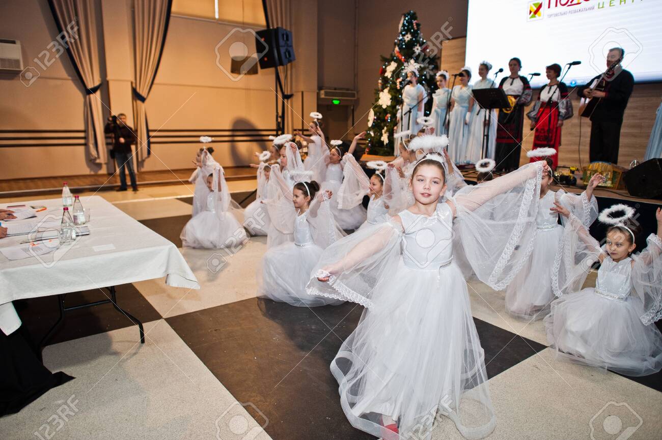 Kyiv, Ukraine - September 1, 2019: Childrens angels in white dresses at Christmas event. - 138123498 Kyiv, Ukraine - September 1, 2019: Childrens angels in white dresses at Christmas event. - 138123498