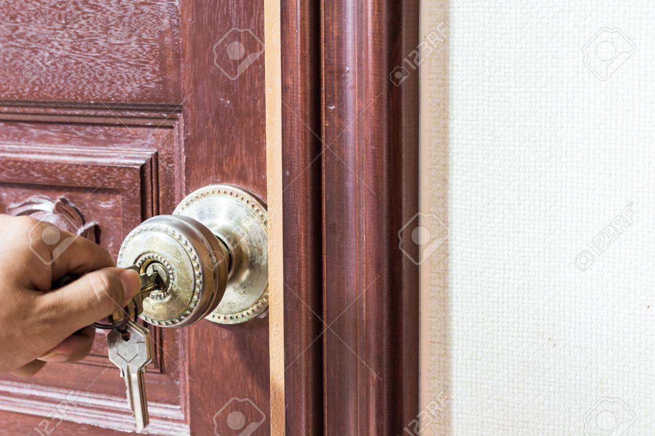man hand Locking the Door - 38782940 man hand Locking the Door - 38782940