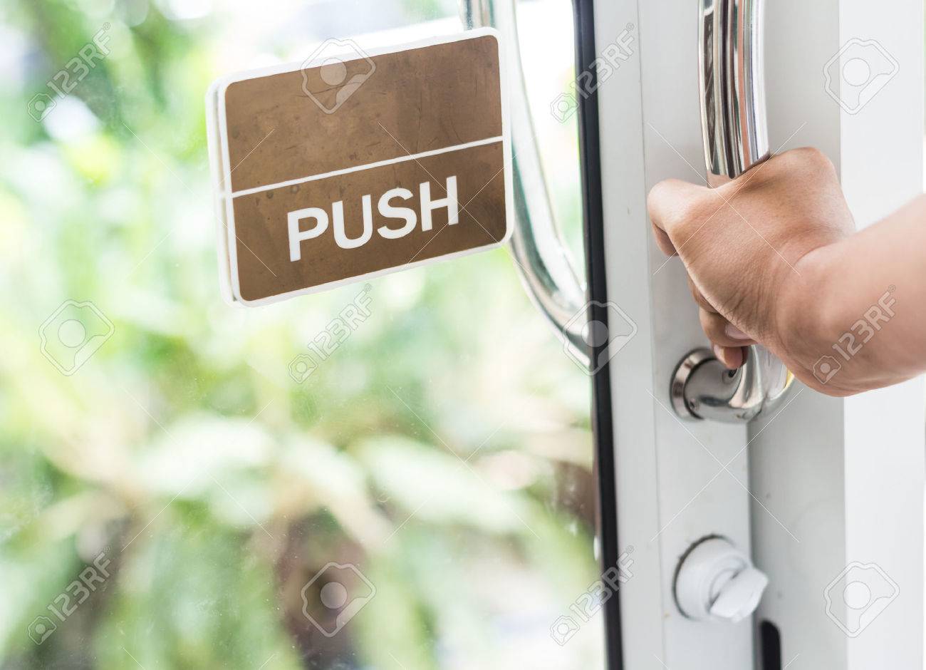 hand push the door - hand focused - 42079029 hand push the door - hand focused - 42079029