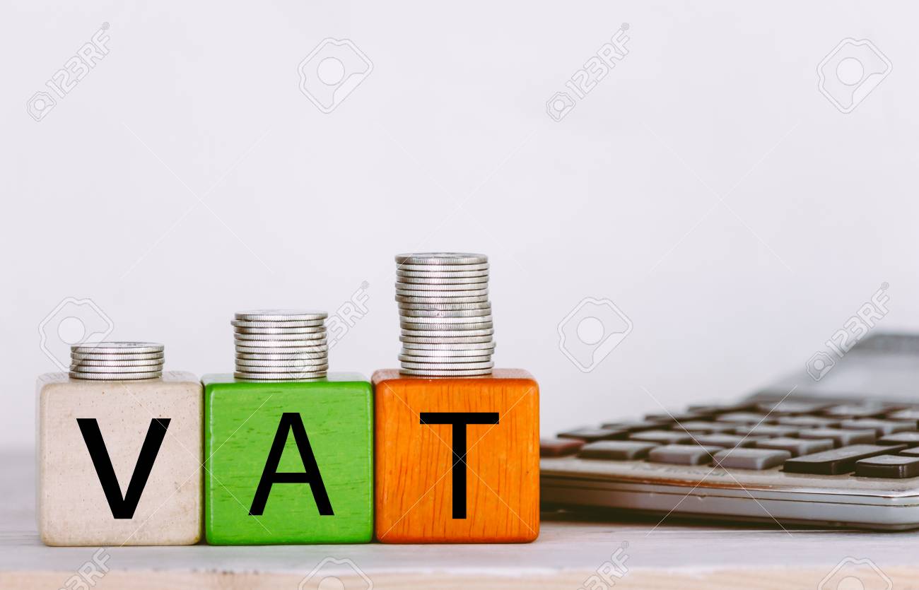 VAT Concept with wooden block with stacked coins - 94508880 VAT Concept with wooden block with stacked coins - 94508880