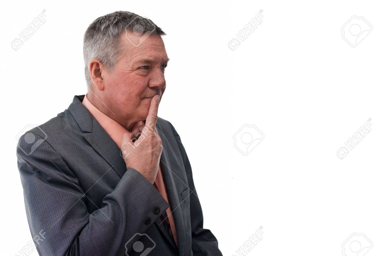 portrait of a senior businessman 3 4 view with finger on mough