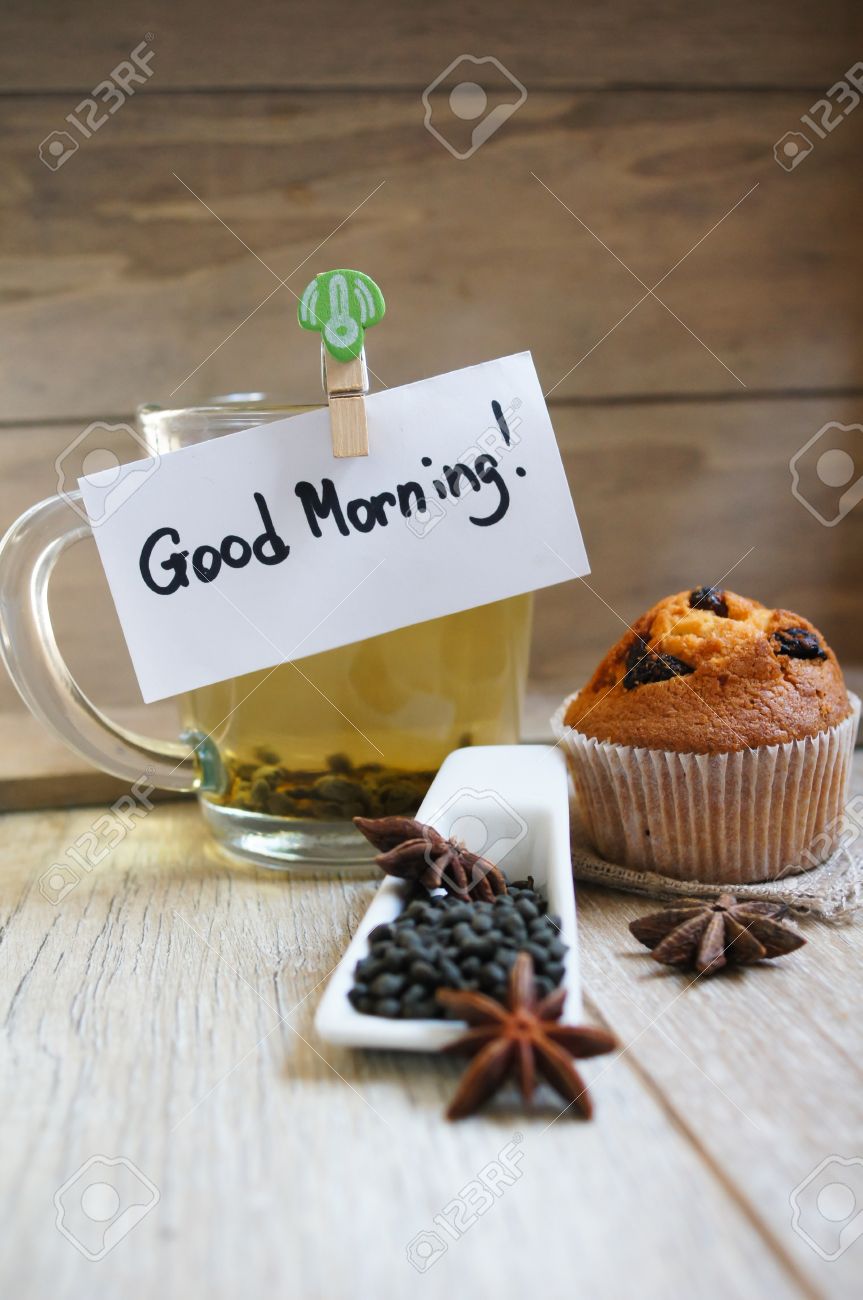 Cup Of Hot Green Tea, Cupcakes And Good Morning Note On The Wooden ...