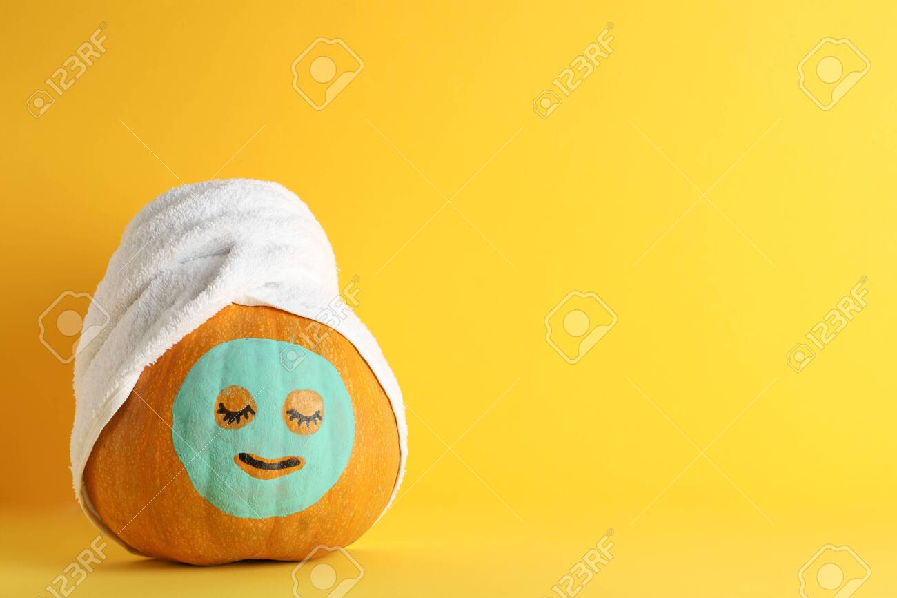 Download Pumpkin With Facial Mask And Towel On Yellow Background Copy Stock Photo Picture And Royalty Free Image Image 131086676 PSD Mockup Templates