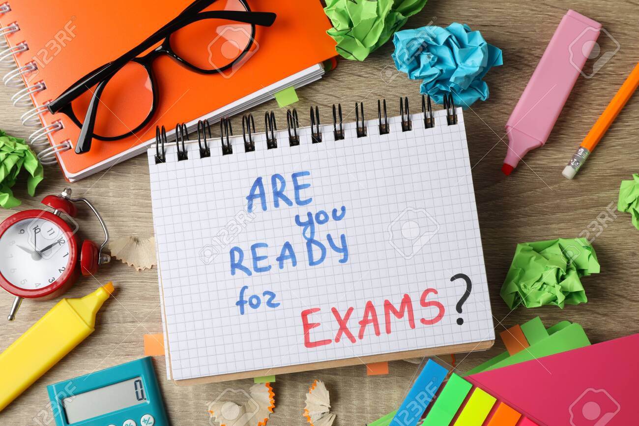 Inscription Are you ready for exams? and different stationary on wooden background, top view - 142050101 Inscription Are you ready for exams? and different stationary on wooden background, top view - 142050101