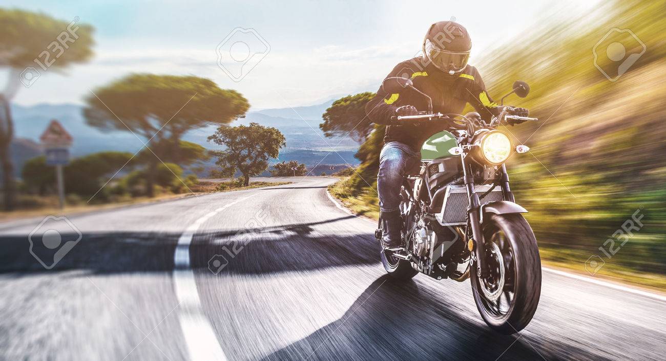 motorbike on the road riding. having fun driving the empty road on a motorcycle tour journey. copyspace for your individual text. - 66204237 motorbike on the road riding. having fun driving the empty road on a motorcycle tour journey. copyspace for your individual text. - 66204237