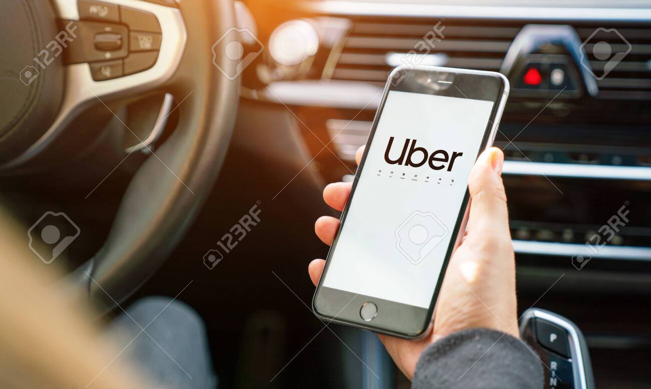 Aachen, Germany September 2019: Uber Driver Holding His Smartphone 