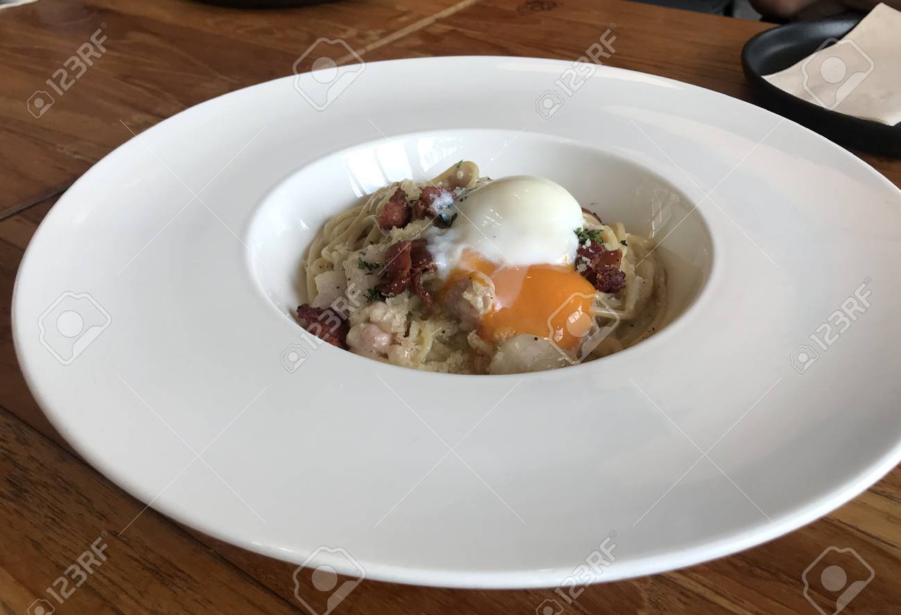Closed Up Of Spaghetti Carbonara With Soft Boiled Egg On Top On White Bowl On Timber Table Stock Photo Picture And Royalty Free Image Image Closed Up Of Spaghetti Carbonara With Soft Boiled Egg On Top On White Bowl On Timber Table Stock Photo Picture And Royalty Free Image Image