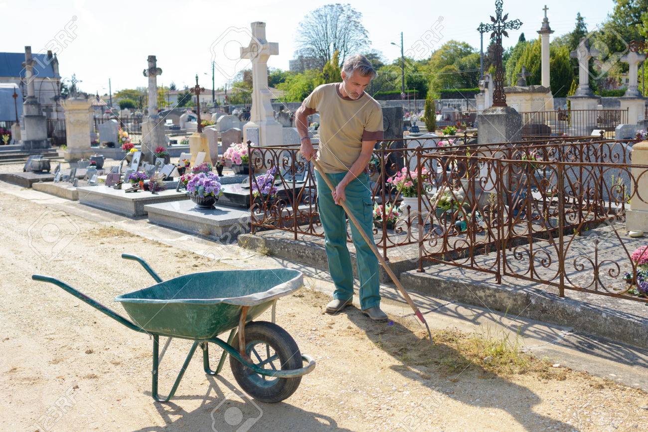 groundskeeper in cemetery stock photo picture and royalty free