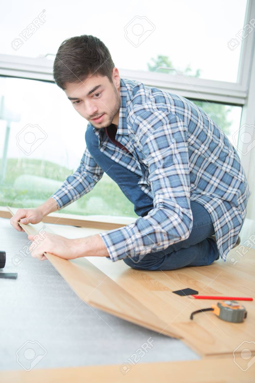 Young Man Fitting Laminate Flooring Stock Photo Picture And