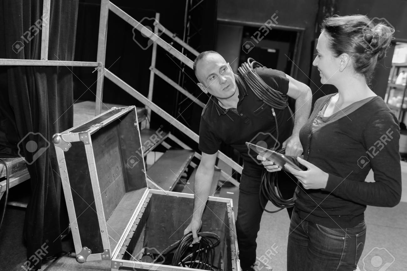 2 stage technicians preparing the stage for tonights show - 83101083 2 stage technicians preparing the stage for tonights show - 83101083