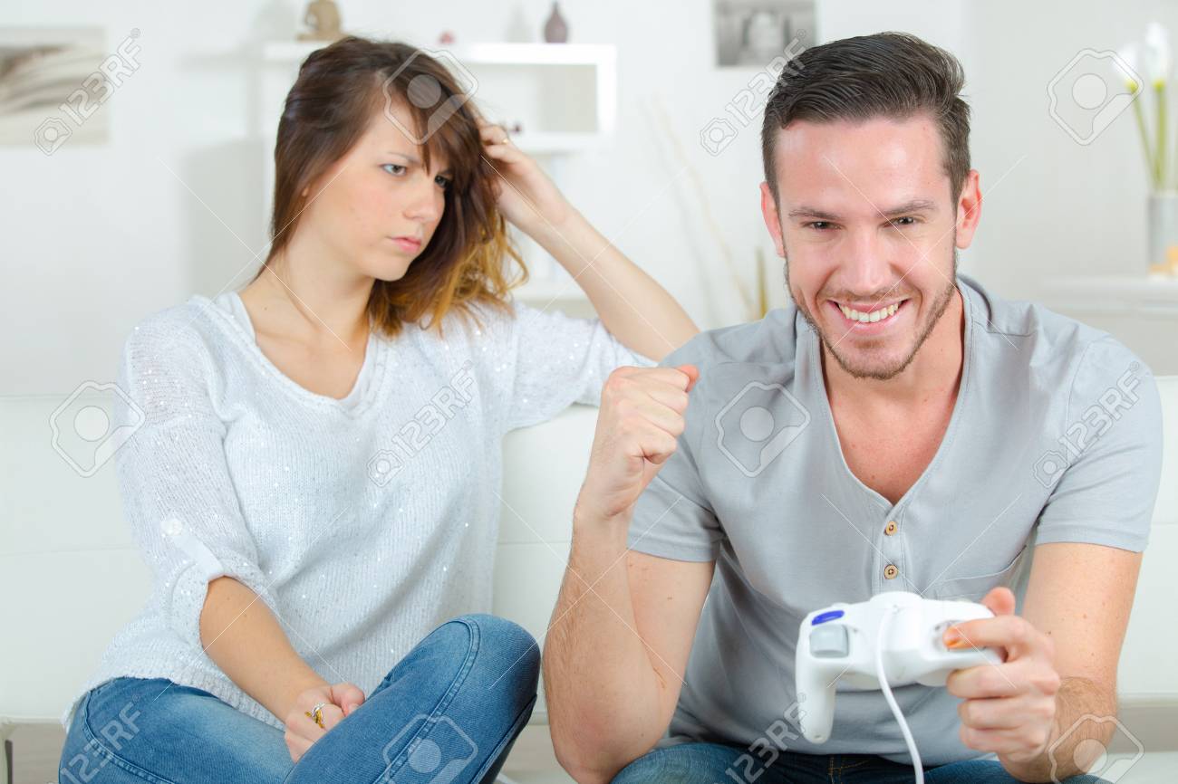 Man And Woman Playing Video Games Stock Photo