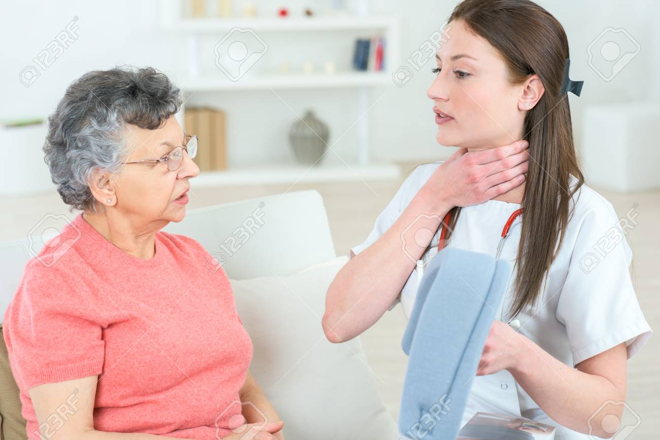nurse explaining old female patient how to use medical assistance free medical assistance