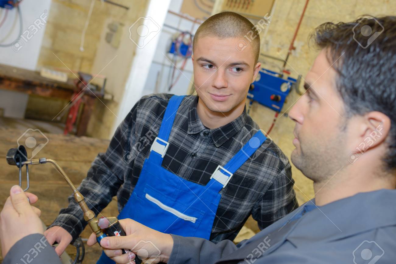male apprentice learning to be welder stock photo picture and apprentice welder