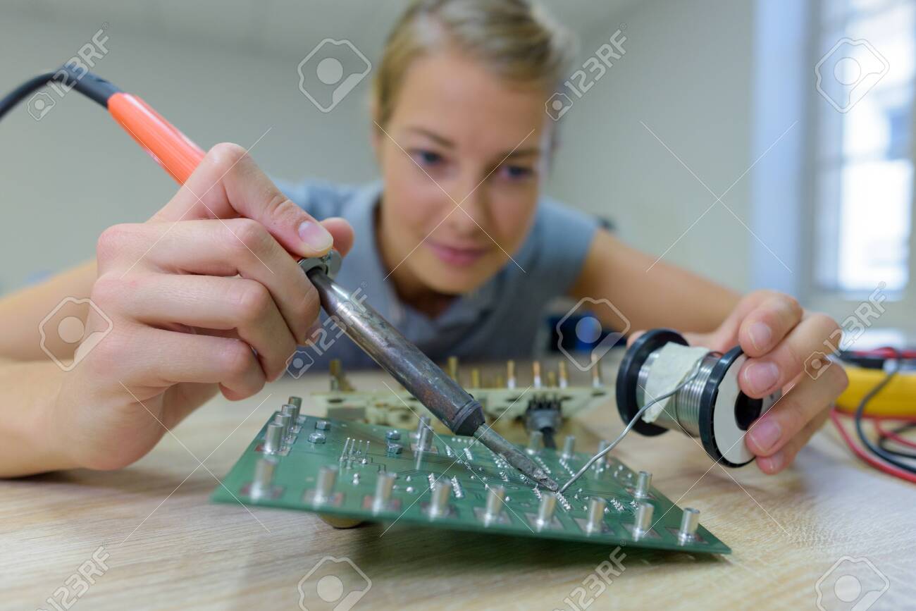 138500939-woman-assembling-works-soldering-iron.jpg