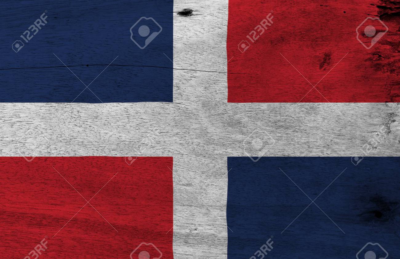 Flag Of Dominican On Wooden Plate Background. Grunge Dominican Flag Texture, A White Cross Into Four Blue And Red At The Top And Red And Blue At The Bottom. Stock Photo,