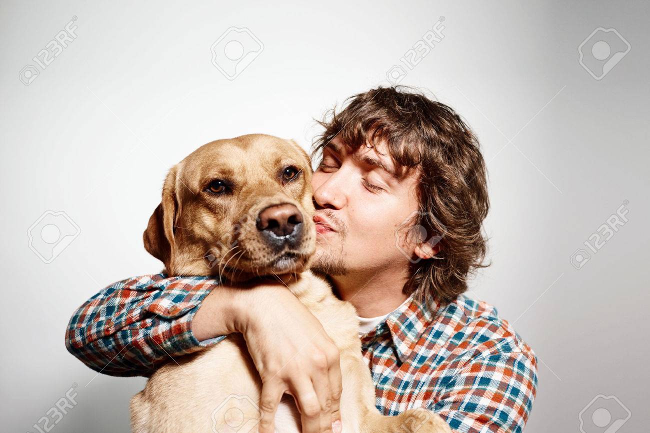 man kissing dog man kissing dog