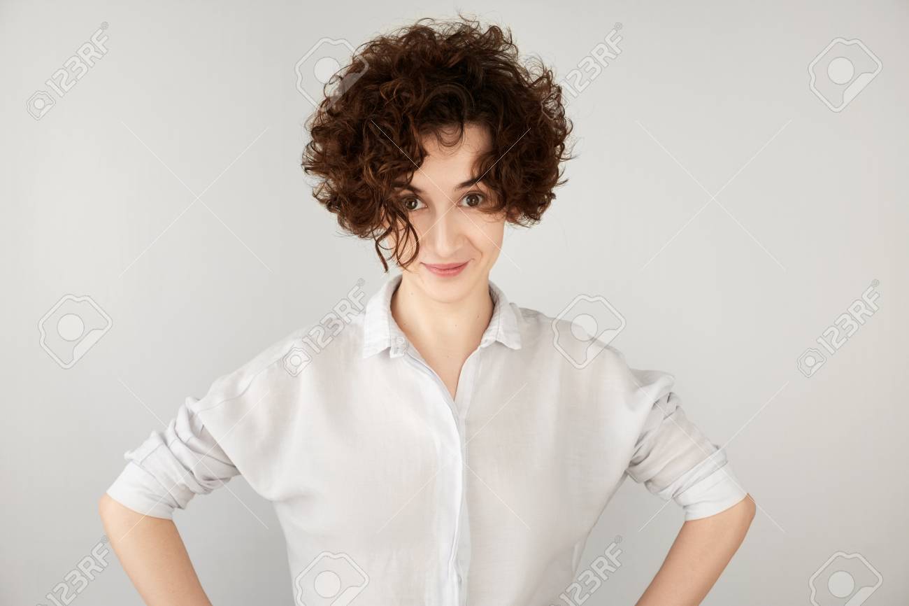 Portrait Of Funny Brunette Hipster Girl With Short Curly Hairstyle