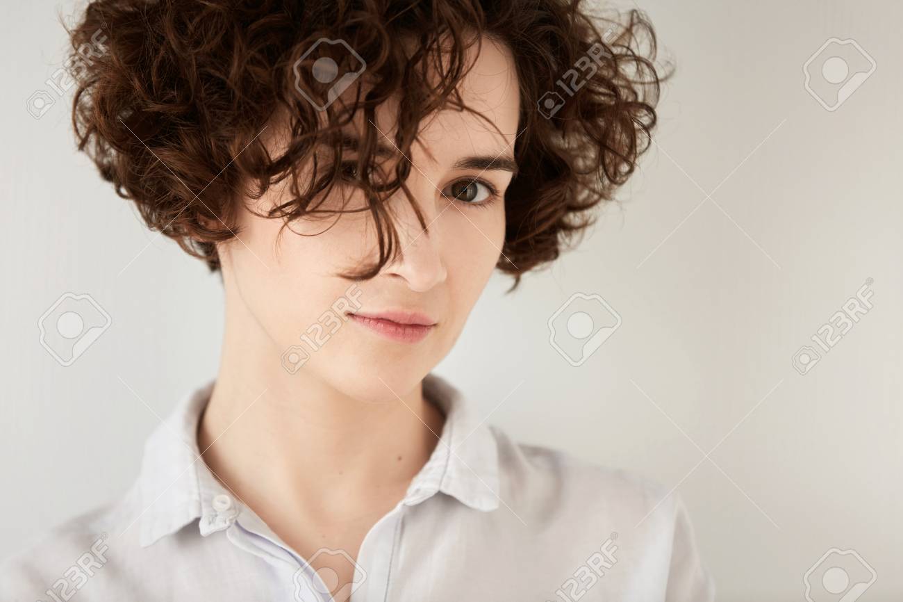 Isolated Headshot Of Beautiful Hipster Girl With Short Curly