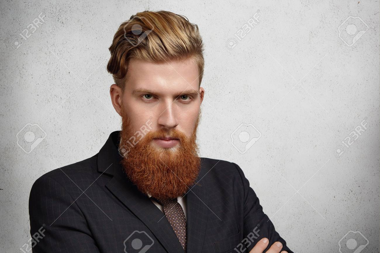 Headshot Of Good Looking Young Corporate Worker With Trendy Haircut