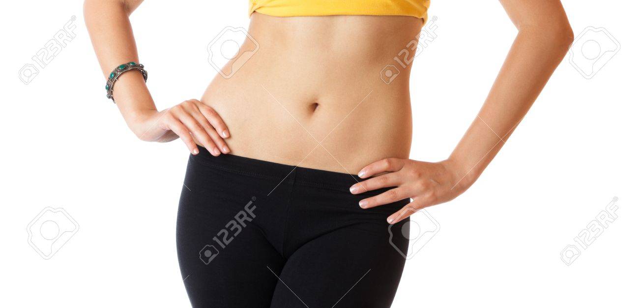 フラット Abs と白い背景で隔離された細いウエスト細い若い女性 の写真素材 画像素材 Image