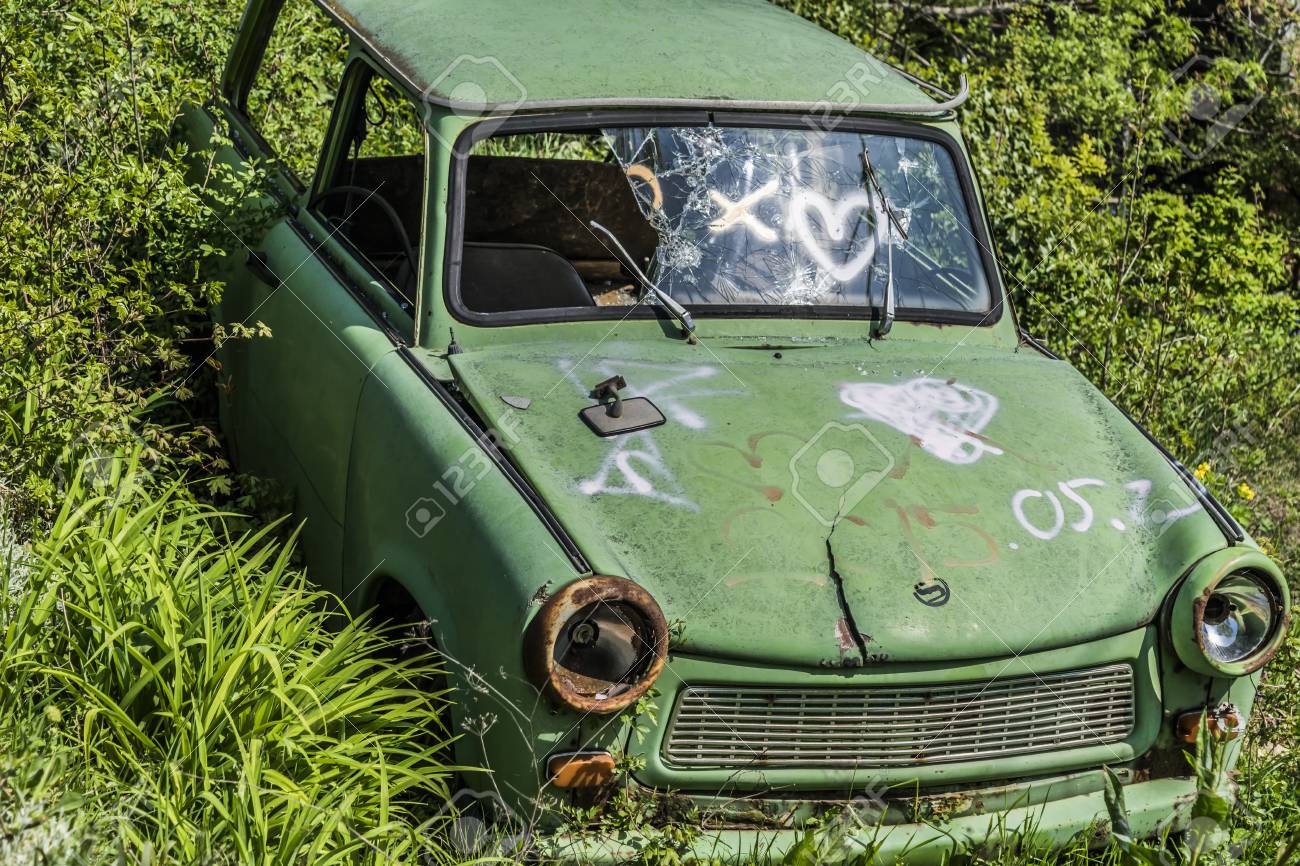 Rusty Abandoned Vintage Green Trabant Derelict Old Car Sits In The Grass Stock Photo Picture And Royalty Free Image Image 89468239