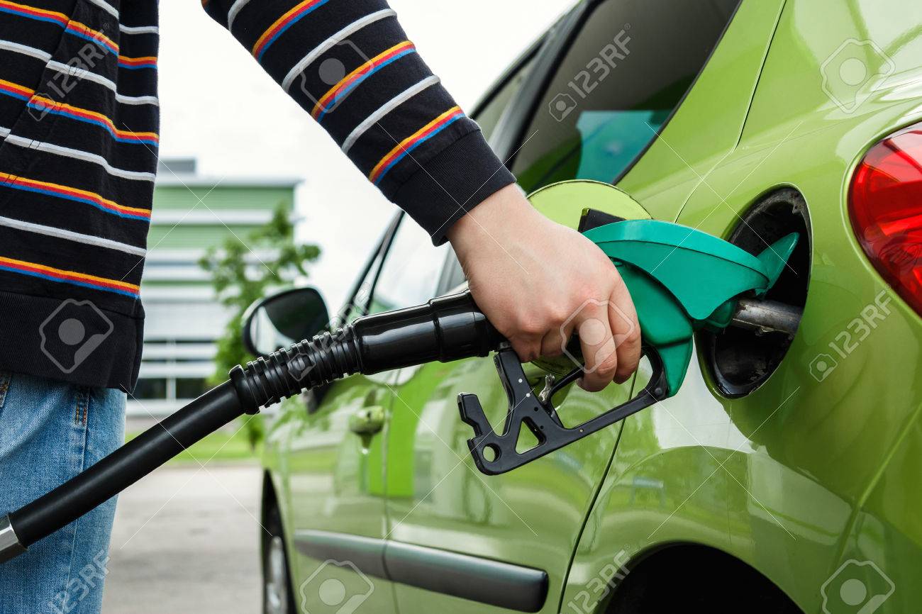 Man fills up his car with a gasoline at gas station - 41847455 Man fills up his car with a gasoline at gas station - 41847455