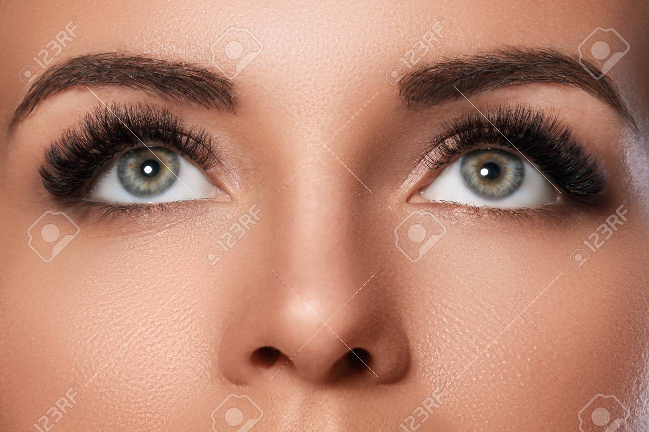 Female face with beautiful eyebrows and artificial eyelashes for maximum volume - 104650836 Female face with beautiful eyebrows and artificial eyelashes for maximum volume - 104650836
