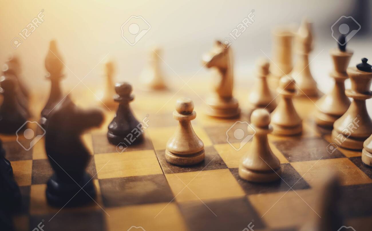 Chess pieces on the Board. Wooden chess pieces on the chessboard. Intellectual game -chess. - 133288614 Chess pieces on the Board. Wooden chess pieces on the chessboard. Intellectual game -chess. - 133288614