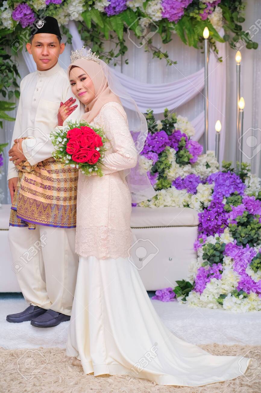 Bride And Groom Pose During Malay Wedding Celebration In Malaysia Stock Photo Picture And Royalty Free Image Image 150215244